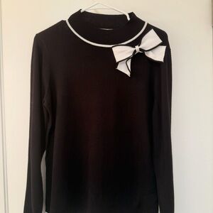 Elegant Black Sweater with White Bow Accent
